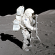 Astronaut Harrison Schmitt, Apollo 17 lunar module pilot, collects lunar rake samples during the mission’s first spacewalk at the Taurus-Littrow landing site.